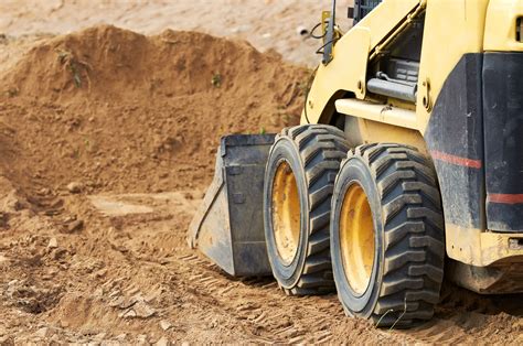 land clearing with a skid steer|skid loader moving tree video.